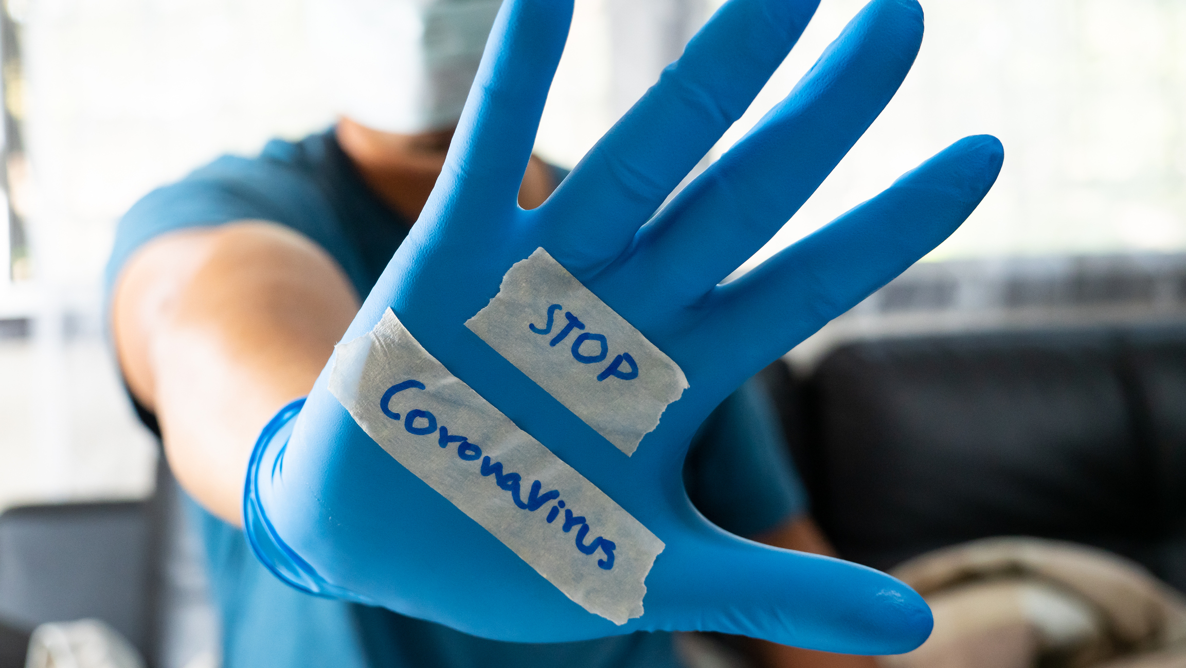 Upl52259880.jpg (The glove-wearer has a message to stop the Coronavirus)